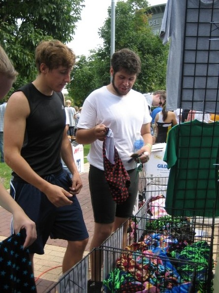 Mike helps Gabe pick out spandex shorts.jpg